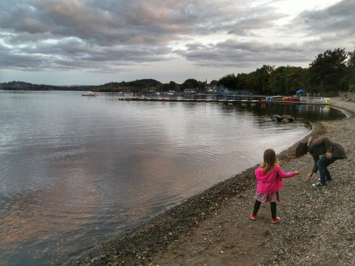 girl in pink body of water cloud reflection