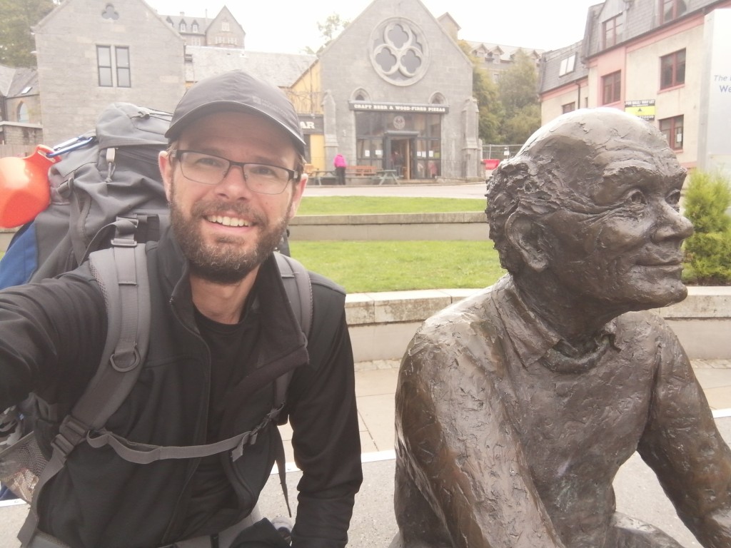 west highland way, scotland, guy in cap, hiking gear, town square