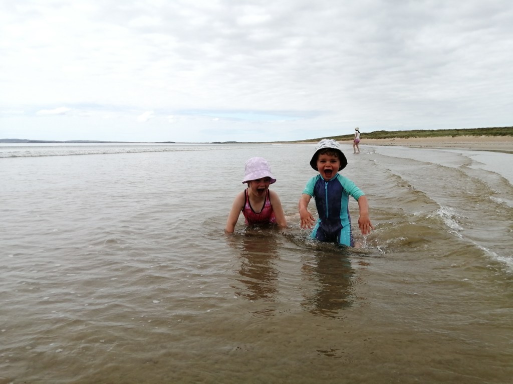 children swimming, children laughing, beach, open water, laggan bay, machrie, islay, scotland
