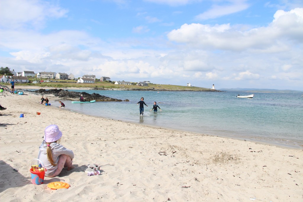 blue skies, white clouds, turquoise water, children playing, white sand, port ellen, islay, scotland 