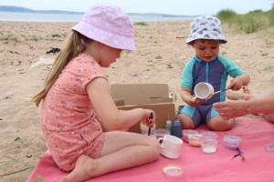 kids on beach, painting, sand, swimming clothes, islay, scotland, holiday, family
