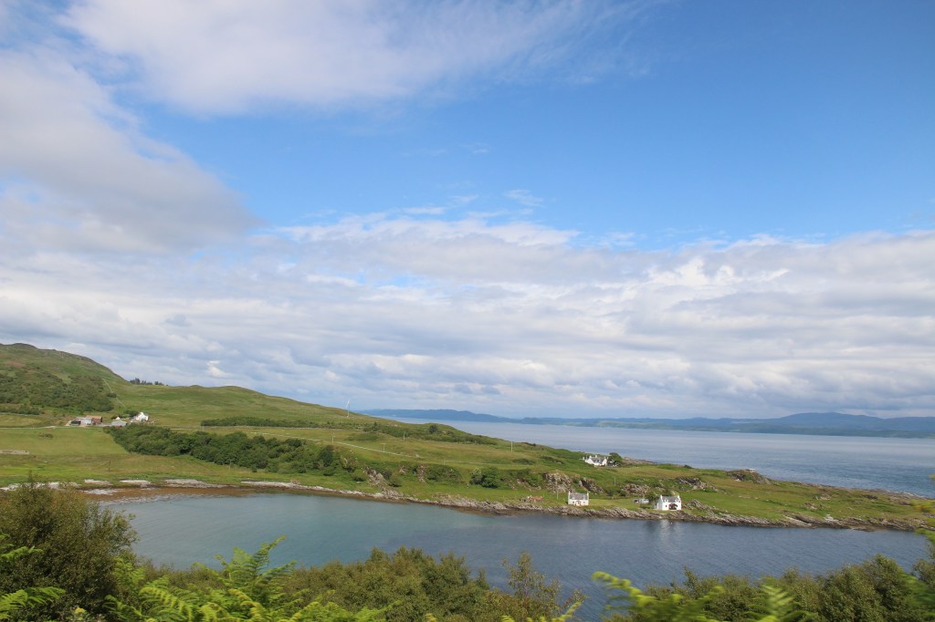 open water, blue skies, white houses, jura, scotland