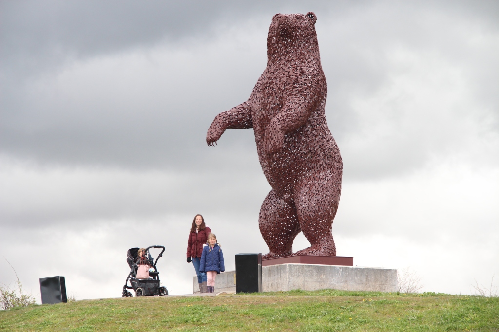 artwork by andy scott, dunbear by dunbar, large bear sculpture, lady and girl with pram