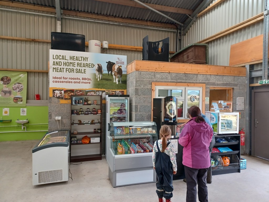 farm shed, farm shop, girl in waterproofs, bellevuw farm