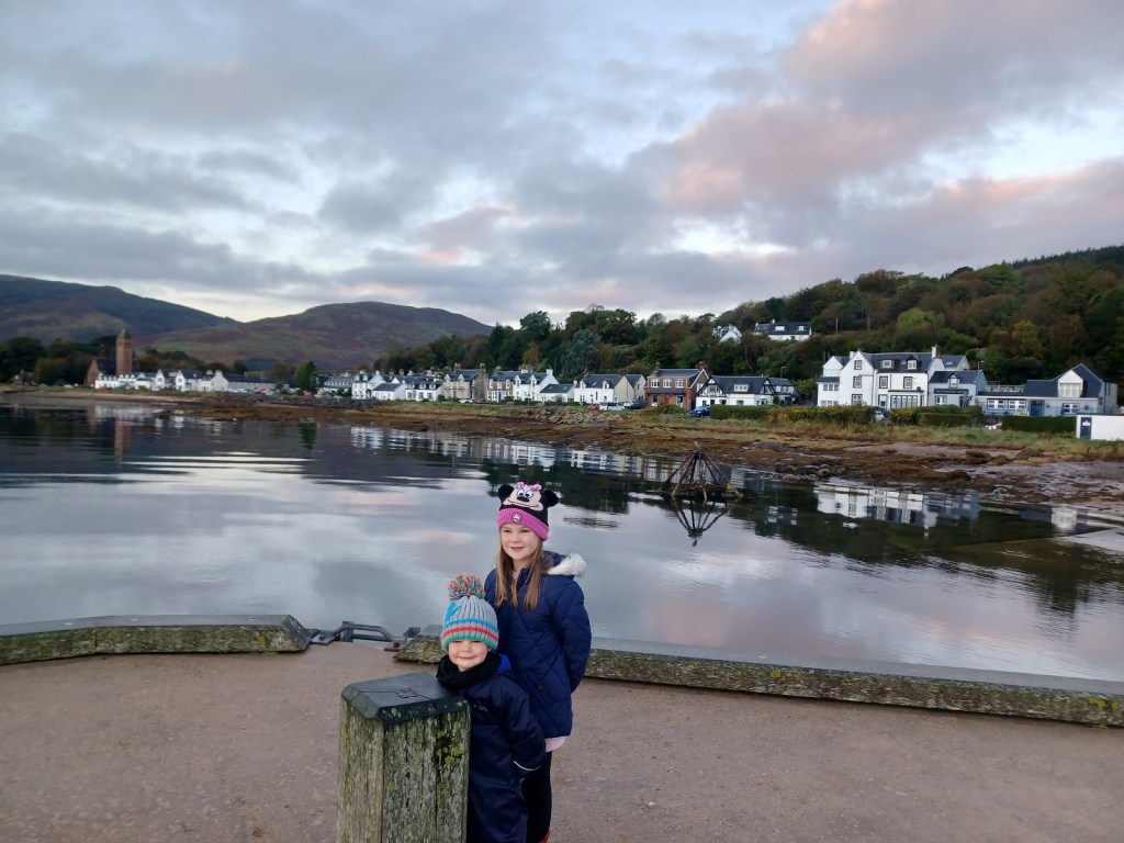 sunrise reflections, Lamlash bay, boy and girl in hats, Isle of Arran